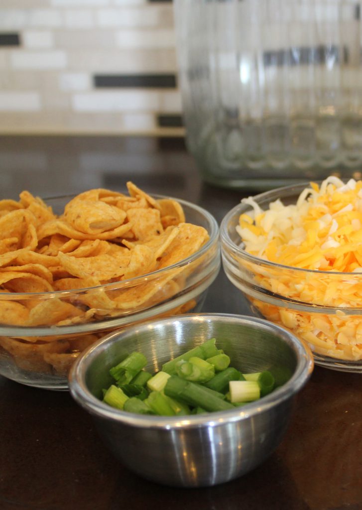 Cheese some more. Yes. Corn chips. Yes. Green onions. Yes. Stomach party time. Yes.