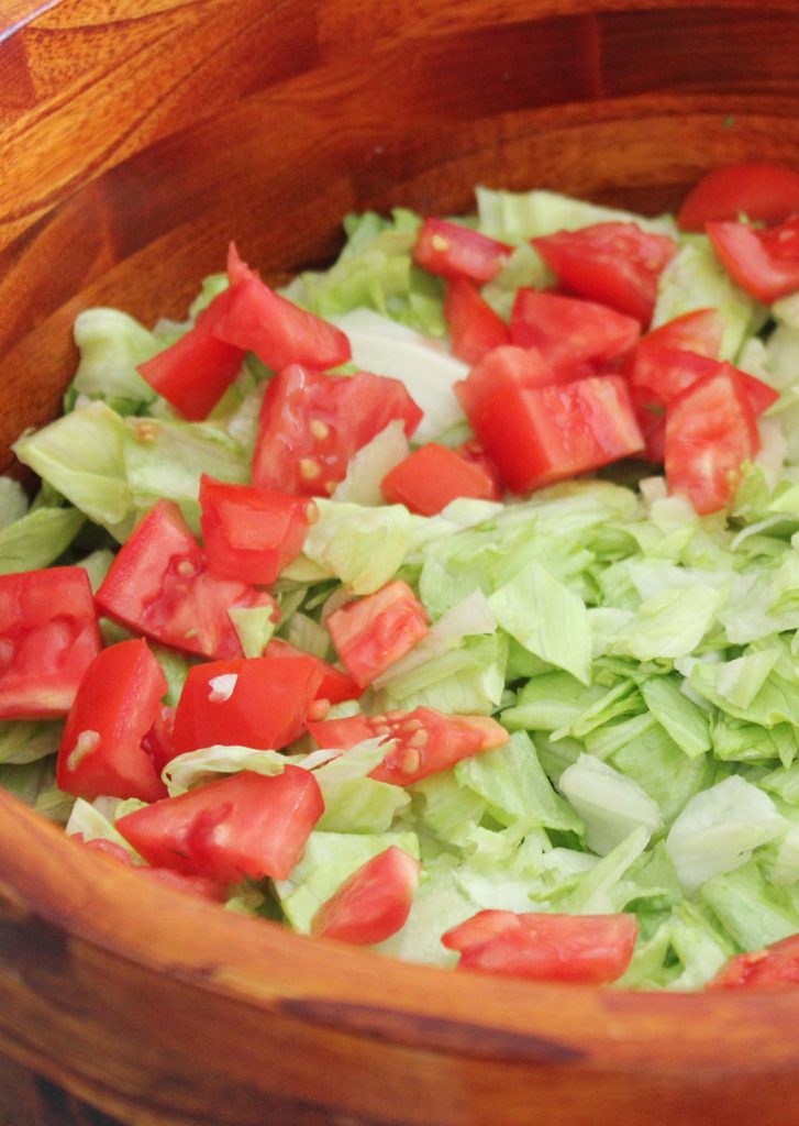 The first layers of the salad. These were really purrty tomatoes. I used romas but you could use whatever looks good. If you are making this in the winter and tomatoes are unavailable where you live, you could sub canned diced tomatoes. 