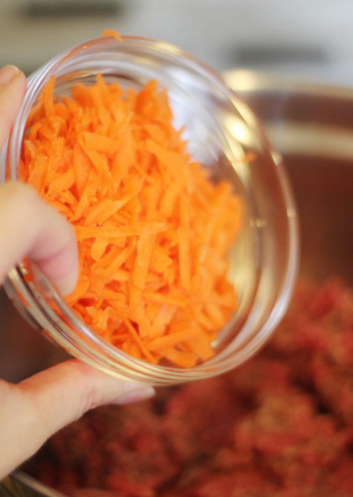 Adding carrots. 